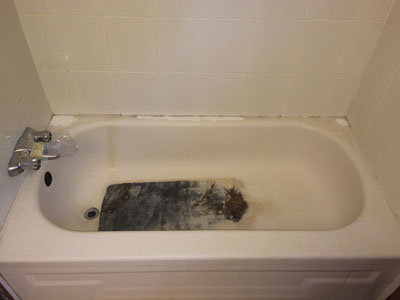 very worn bath tub bottom